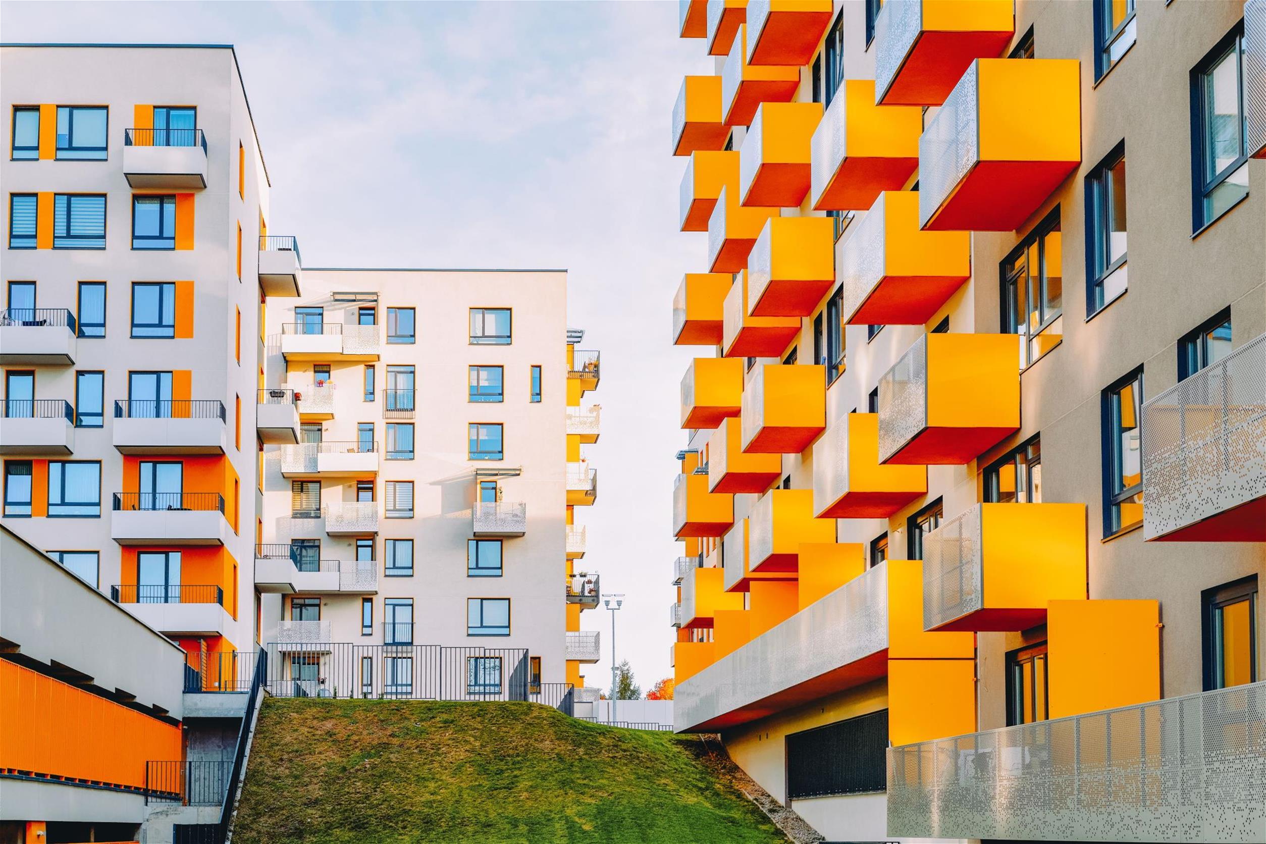 Apartment buildings with balconies surrounding a terrace